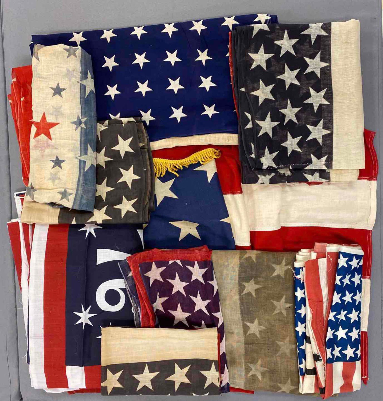 Large Group of Patriotic Buntings and Uncut Flags: There is some staining and damage.