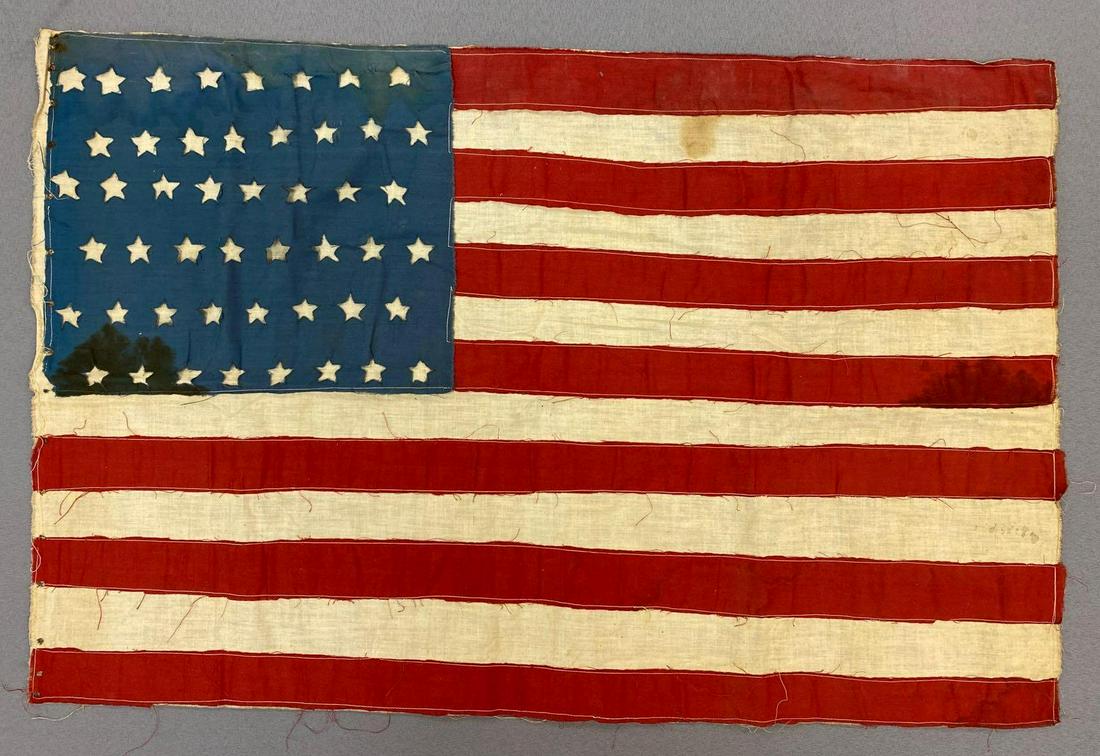 Vintage 48 Star Flag, Cut Out Stars, Sewn Stripes: Measures 17 3/4 x 26 3/4 inches. Has some staining and fraying.