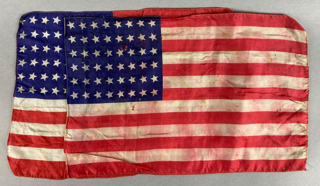 Group of 2, 48 Star Flags: Each measures 17 1/2 x 11 3/4 inches. Each has some staining and damage.
