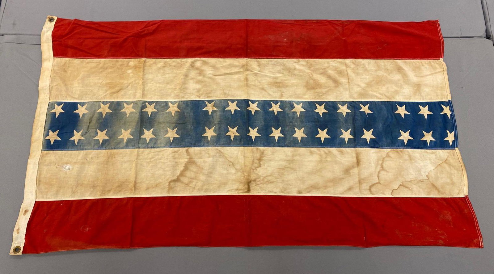 Rare Vintage 34 Star American Flag: Bunting vintage American flag. Measures 32x58 inches. Wall hanging banner. Staining throughout front and back.