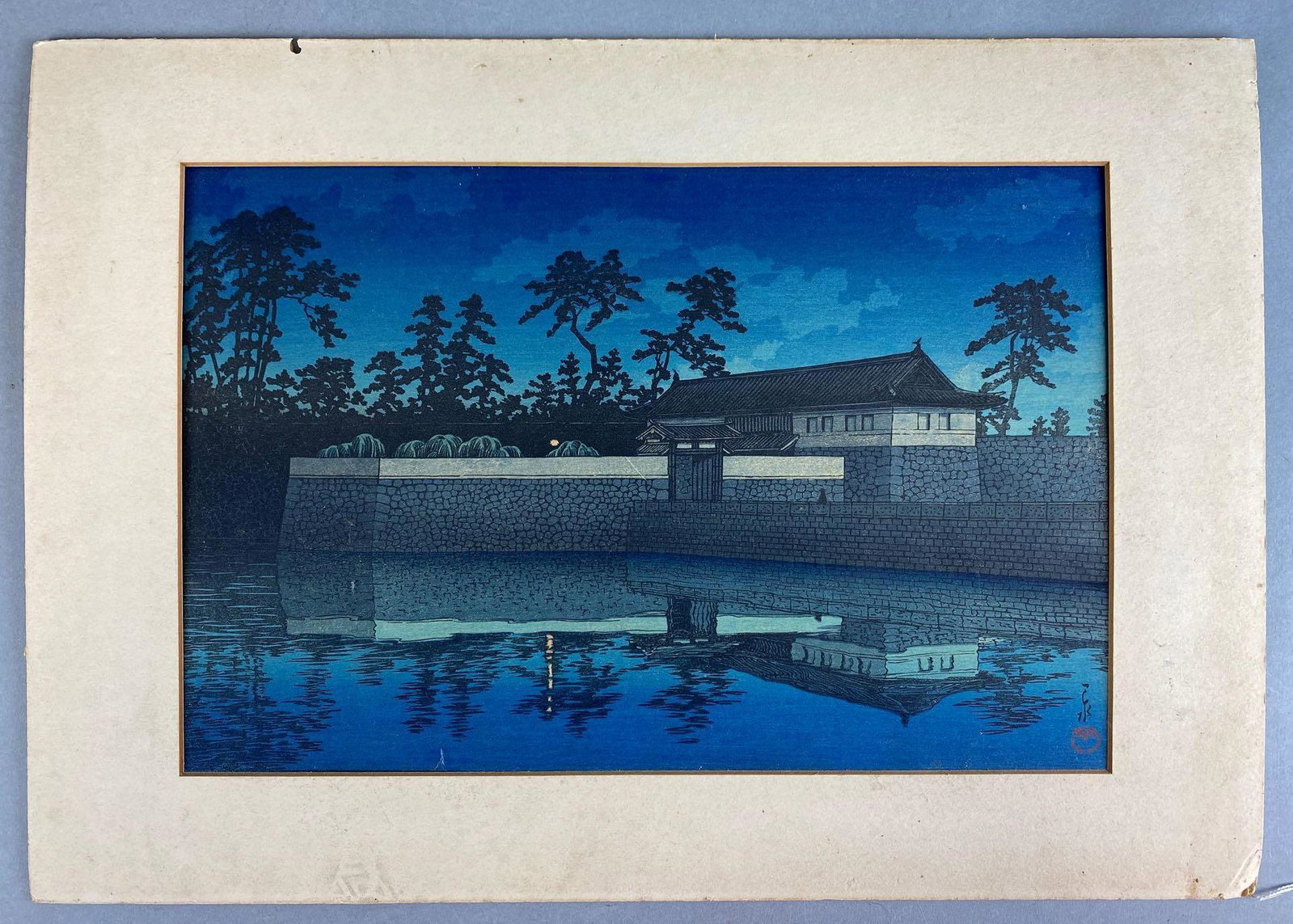 Kawase Hasui Woodblock Print Sakurada Gate: Printed in the 1930s. Glued between mats. Print measures approximately 14 3/4 x 10 1/4 inches.