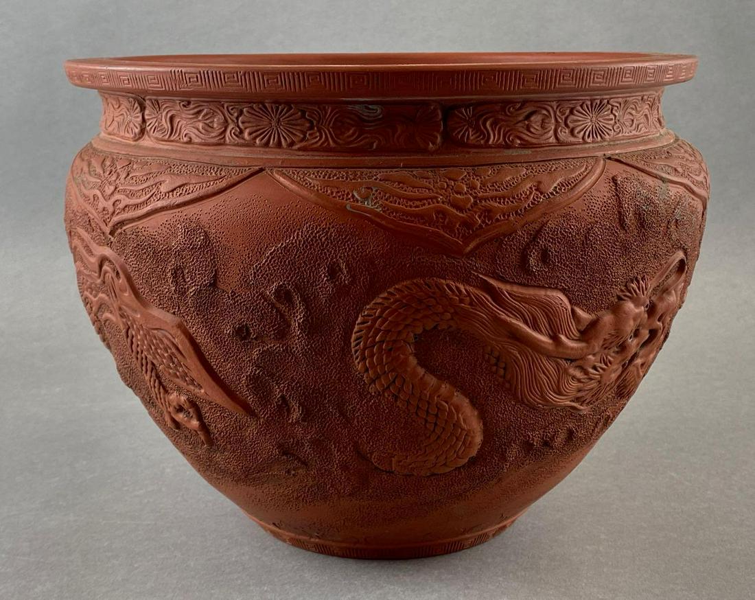 Chinese Stoneware Pot with Dragon Design: Stoneware painted to look like redware. Heavily decorated and textured. Minor chips. Measures 7.5x10in.