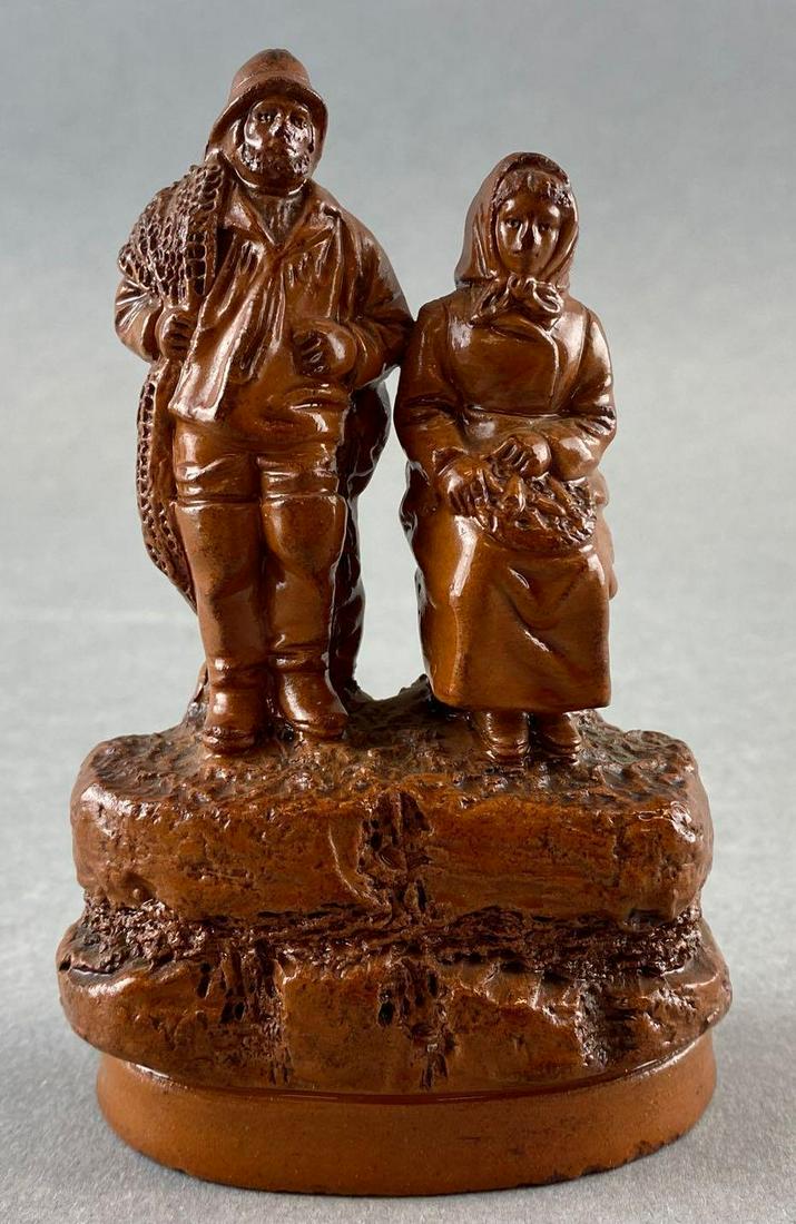 19th Century Redware Fisherman and Wife Figurine: Artist signature engraved on back. Stands 4.5in tall.