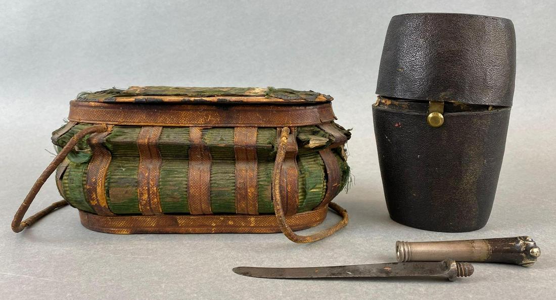 Early 19th Century Picnic/Mess Kit Bags: (1) Green/Brown wooden basket, multiple holes, pieces falling off, measures 8.5in across. (1) Black cylindrical kit with screw together knife, hinge broken, interior ripped.