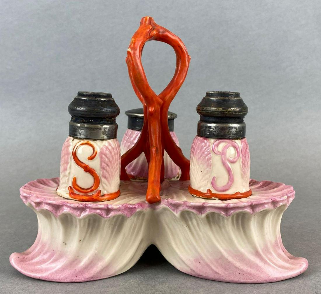 Vintage Salt, Pepper, and Sugar Carrier Set: Pink seashell patterned ceramic, some scuffing and discoloration on tops. Carrier measures 6.5in tall.
