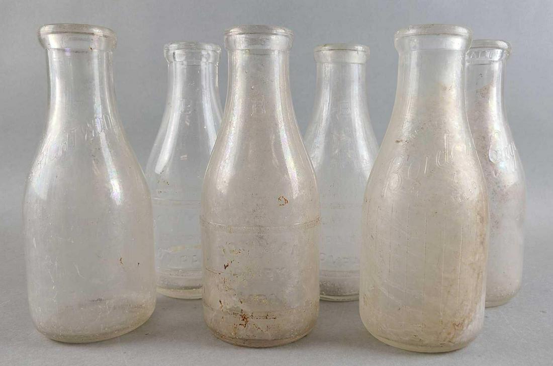 Group of 6 glass milk bottles: Wrightwood, Borden, Bowman, White Eagle. Quart size, 9 inches tall. Need cleaned