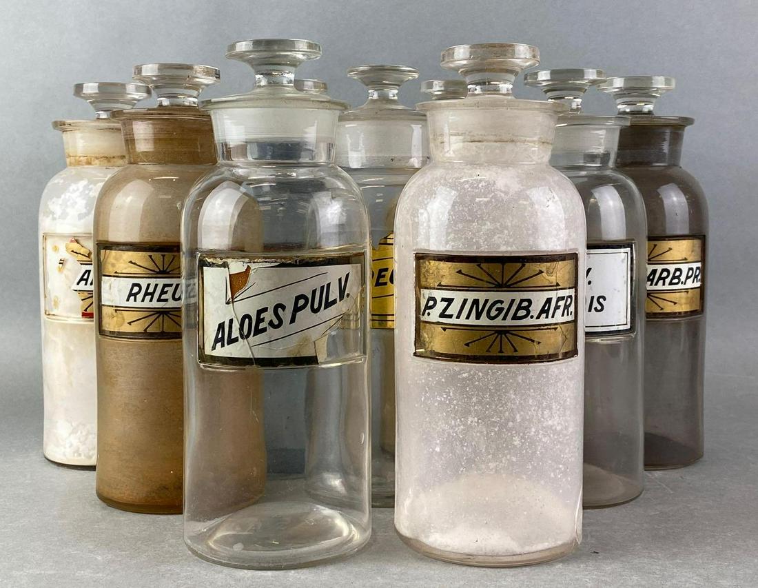 Group of 9 Glass Apothecary Jars: glass labels - very fragile, 9.75 inches tall