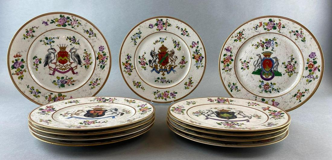 11 Piece Edme Samson Armoral Plates: Assorted coats of arms with various Latin phrases underneath. Textured ceramic dishes with artist mark on the back. Measures 9.5in in diameter.