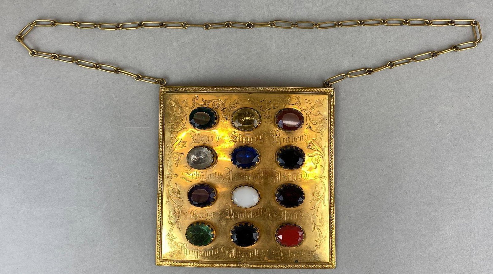 Order of Odd Fellows Tribes of Israel Breastplate: Faux stones adorned and labeled on gold tone metal plate, measures 6.5inx6.5in.