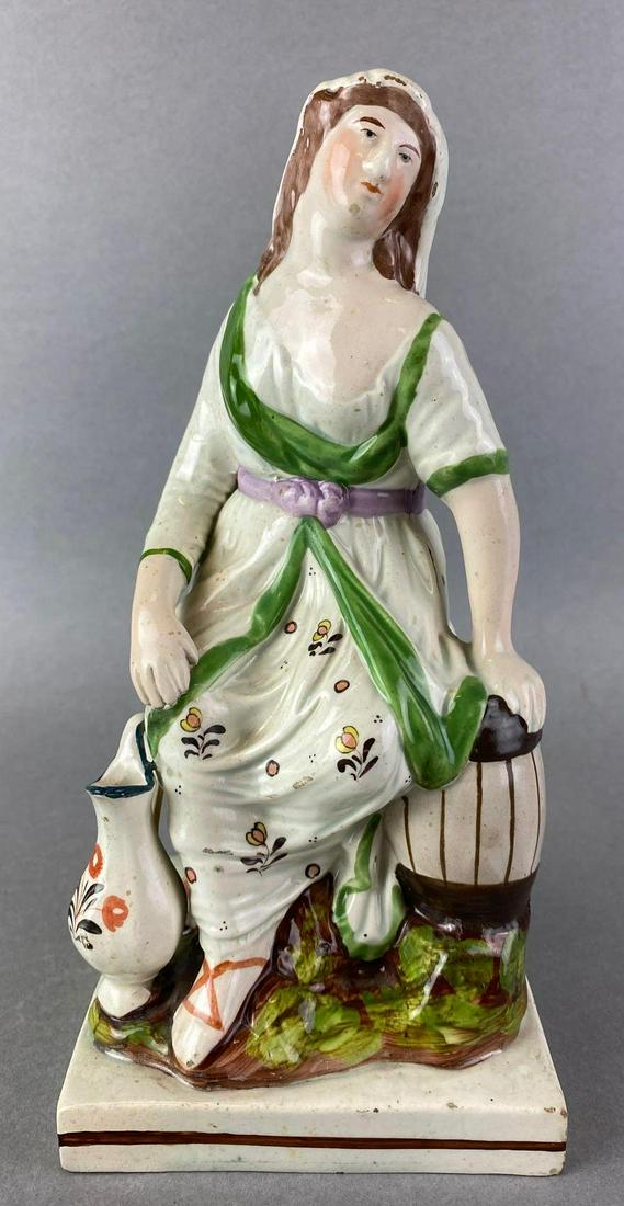 Staffordshire Seated Widow Pearlware Figurine: circa 1800s, hand painted, some chips, cracking, 9 inches tall