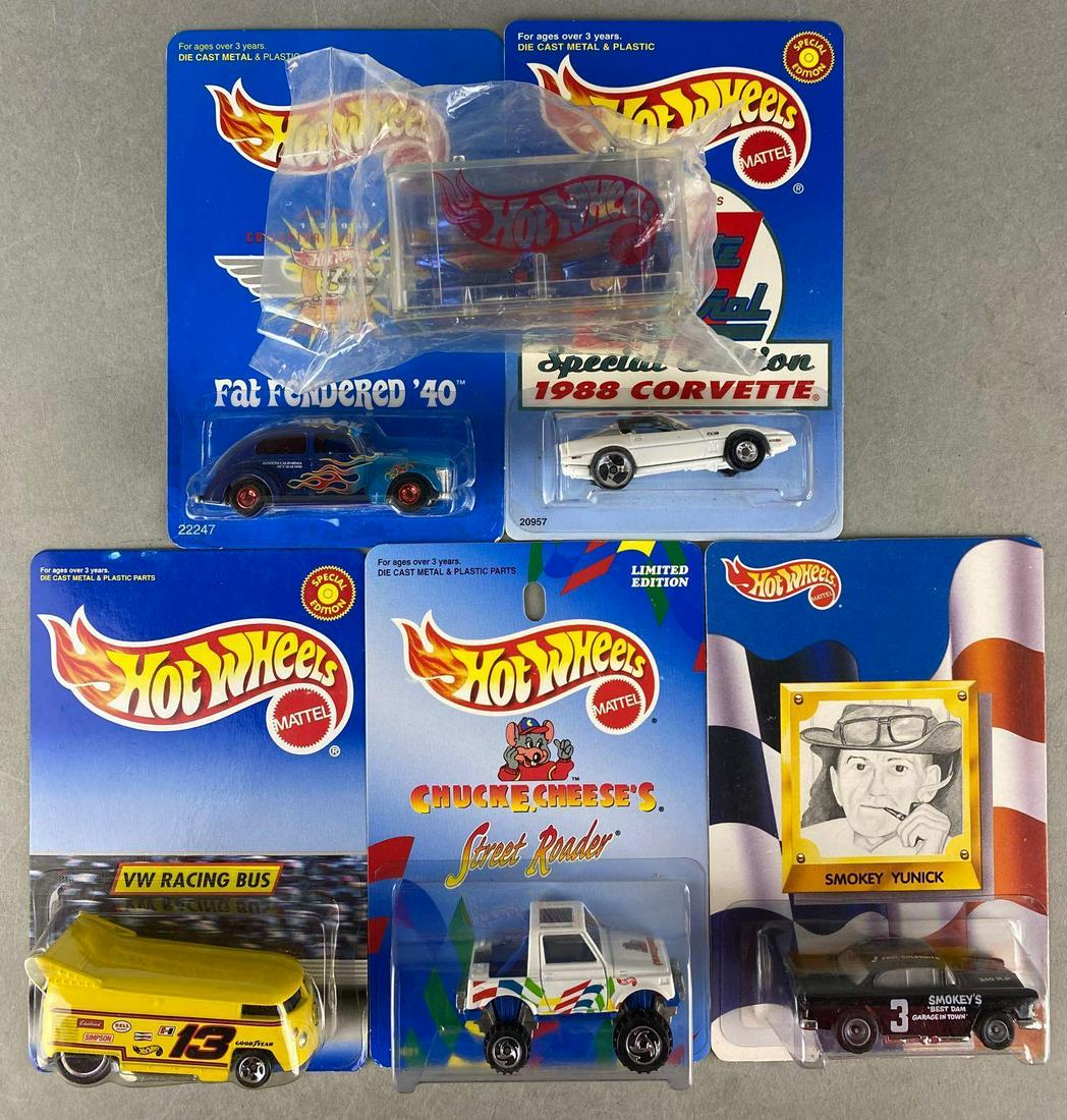 Group of 6 assorted Hot Wheels die-cast vehicles: 1996 New York Toy Fair, VW Racing Bus, Chuck E Cheeses Street Roader, and more. New in original packaging, some shelf wear