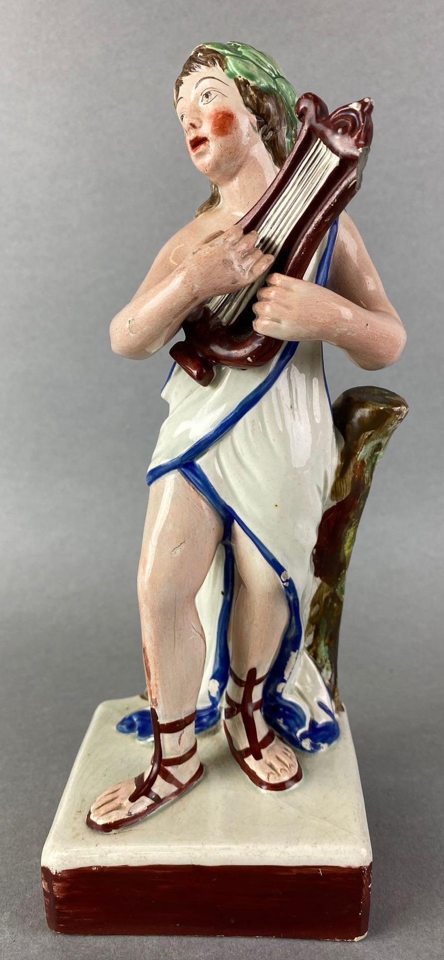 Boy Holding Harp Figurine: hand painted, crazing, some cracks, some pieces chipped off, 8.75 inches tall