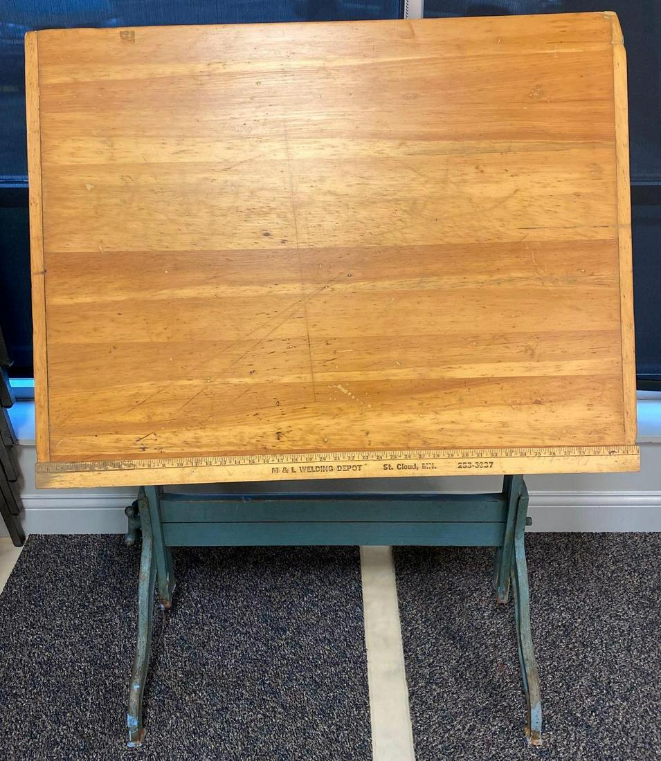M&L Welding Depot Drafting Table: 41 x 42 x32in when tabled, marks and scratches consistent with use, some rust on legs. No Shipping.