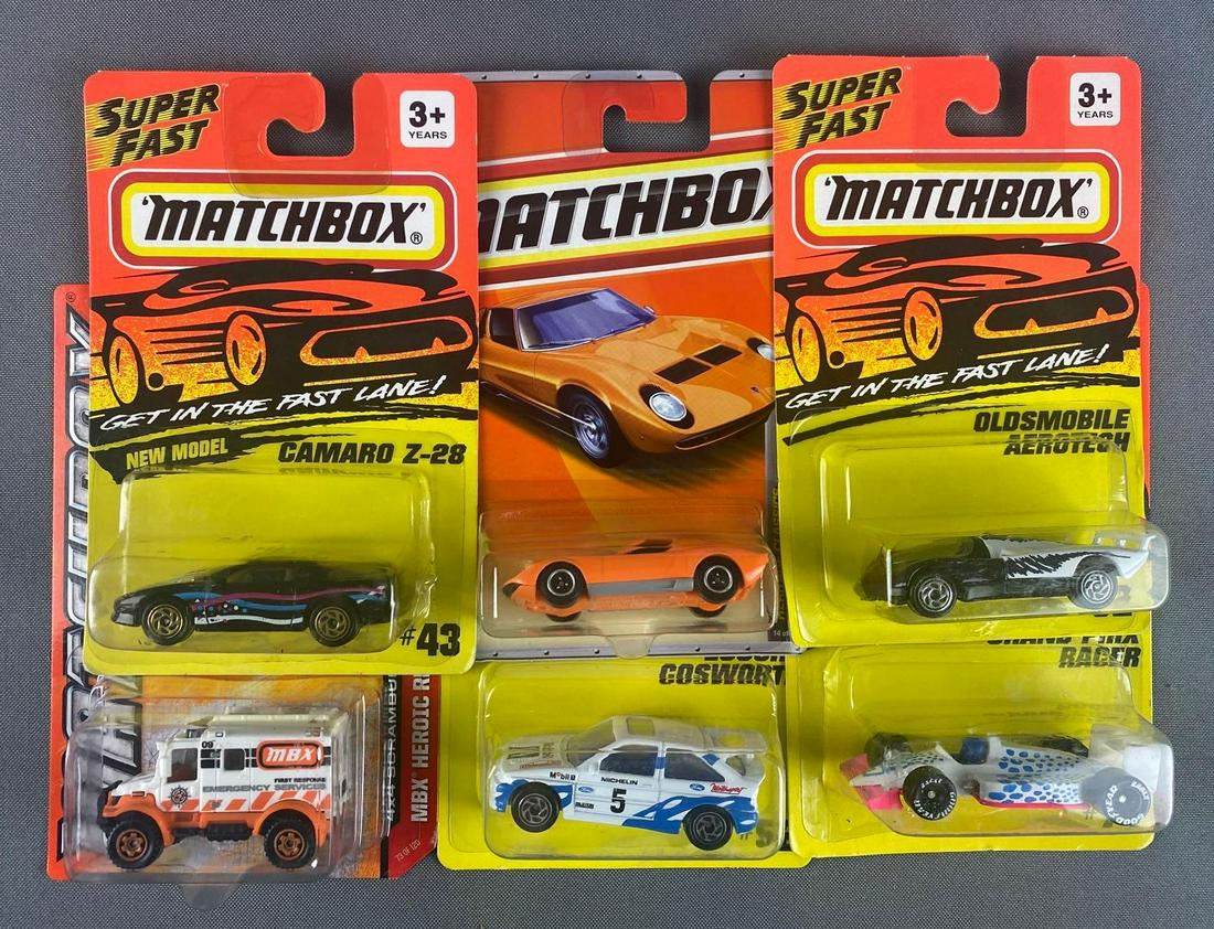 Group of 30+ Matchbox Die-Cast Vehicles: Original packaging. Some blisters slightly dented.
