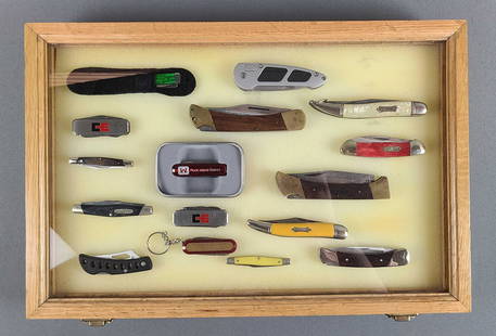 Group of Pocket Knives in display case: Assorted styles and sizes. Largest is 5 inches folded.