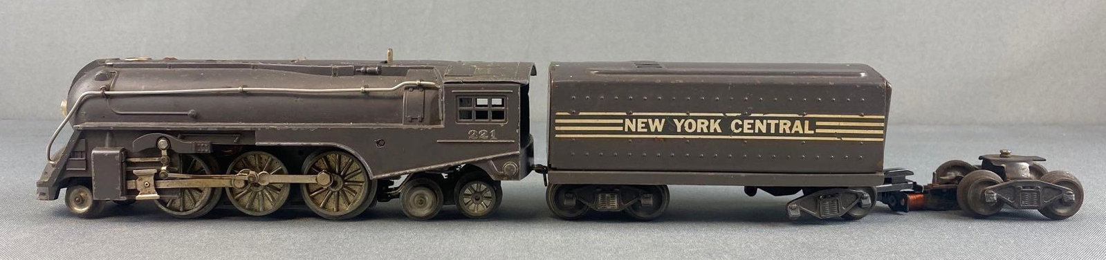 Lionel O Scale 221 Locomotive and and 221W whistle Tender: Rare early aluminum wheel drive train. Untested. Locomotive measures 9 1/2 inches. Tender is 6 inches.
