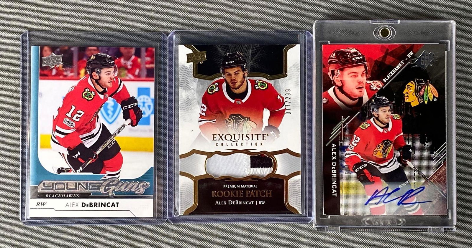 Group of 3 2017-18 Upper Deck Alex DeBrincat Cards (1 of 5)