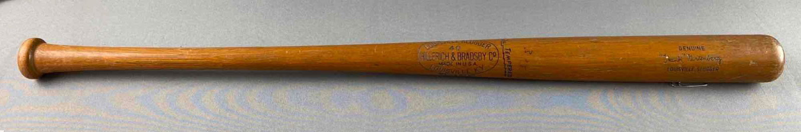 1930s-40s Louisville Slugger 40 Hank Greenberg Baseball Bat: NOS. Store bought. Saddle brown finish. Measures 36 inches long.
