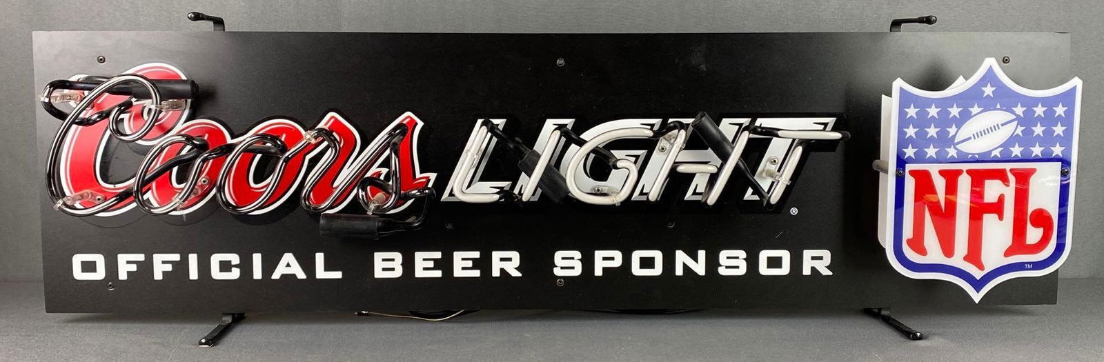 Coors Light Light-Up Neon Advertising Sign: Official beer sponsor of the NFL, 2007, working condition, measures 11 X 37 X 2 1/2in, third party shipping recommended.