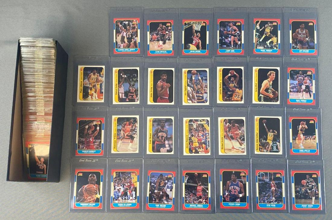 1986-87 Fleer Basketball Set and Stickers: Here is a sharp raw set that is ready for some grading. The Michael Jordan Rookie is perfectly centered but has some slight recoloring.