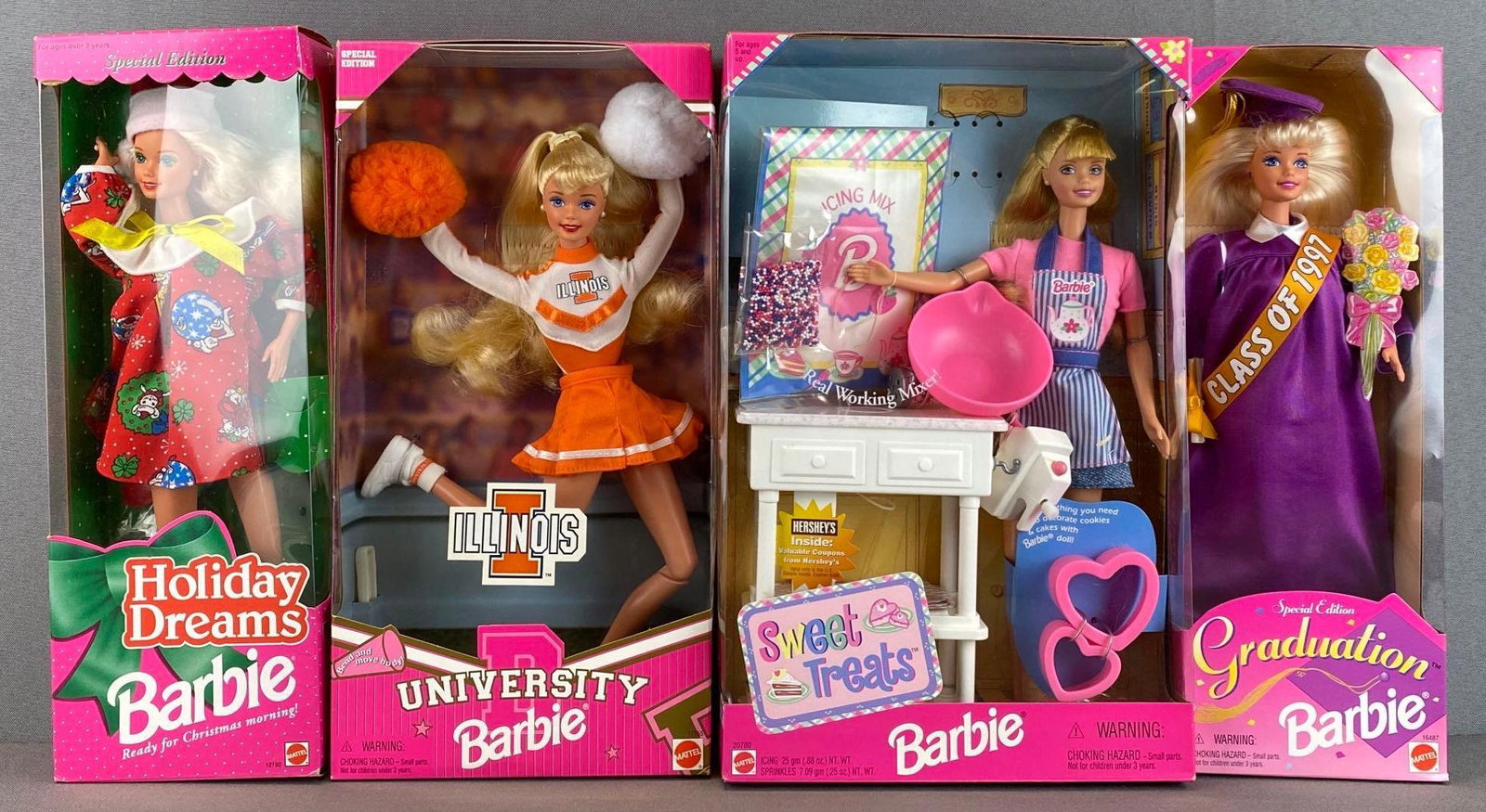 Group of 4 Mattel Barbie Fashion Dolls: includes 1996 graduation, 1998 sweet treats, 1997 Illinois university, and 1994 holiday dreams