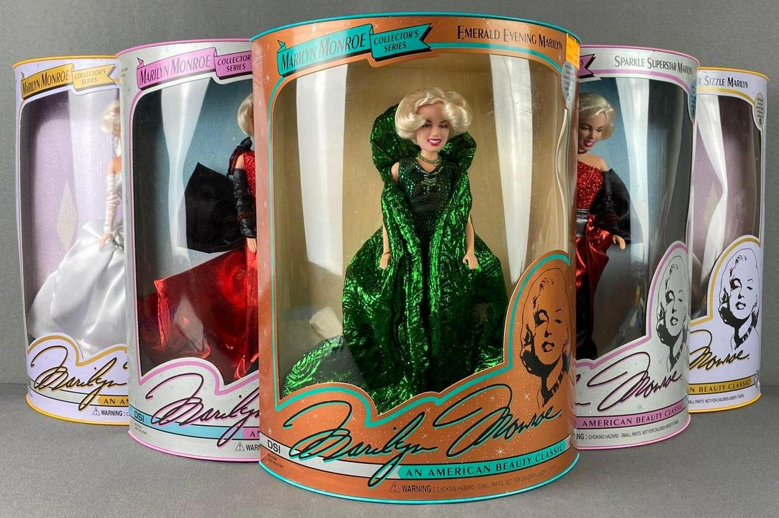 Group of 6 DSI Marilyn Monroe Fashion Figures: 1993. Collectors Series. Includes Emerald Evening, Sparkle Superstar, and more. New in original packaging. Some blisters dented.