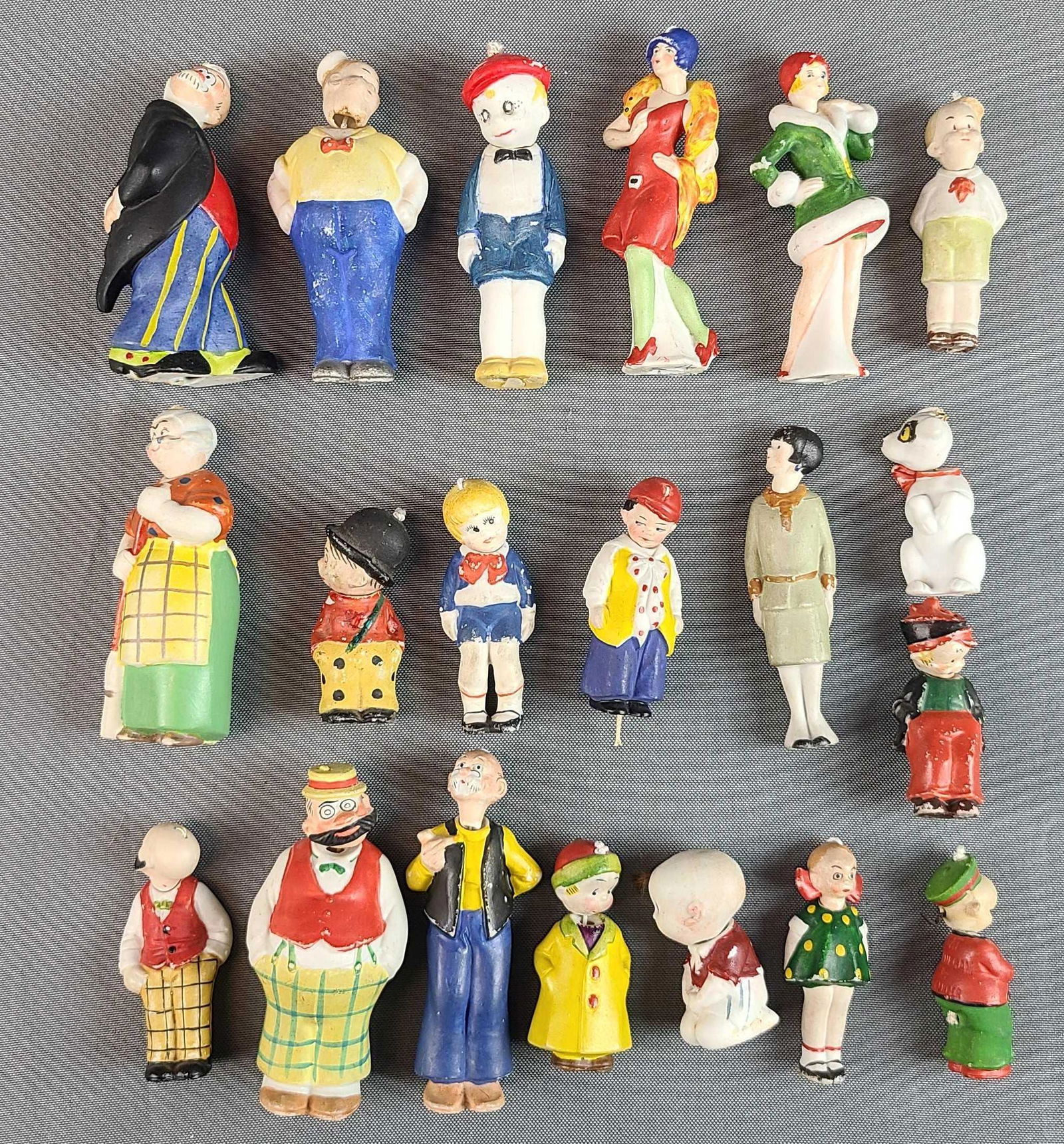 Group of 21 Comic Nodders: German bisque bobbleheads. Includes Pat Finnegan, Josie, Buttercup, Nicodemus, Ma Winkle, Winnie Winkle, and more