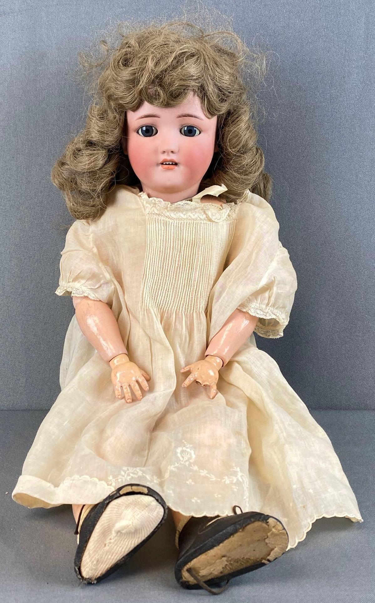 Simon and Halbig Bisque Head Doll: Measures 22in tall, jointed doll, missing two fingers on left hand, several cracks on legs.