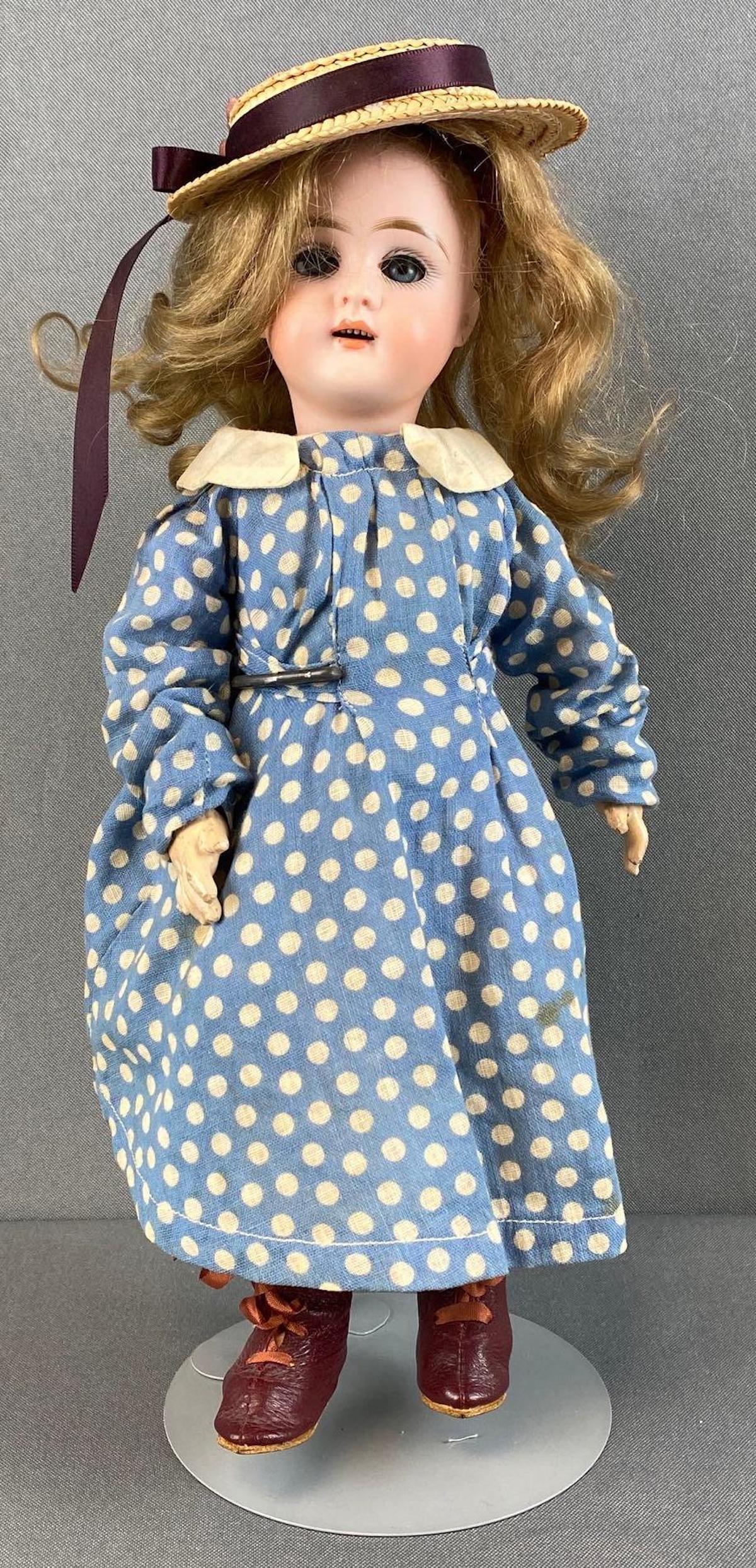 Antique Bisque Head Doll: Neck reads DEP 297, wig not attached, legs splintering, measures 12in tall.