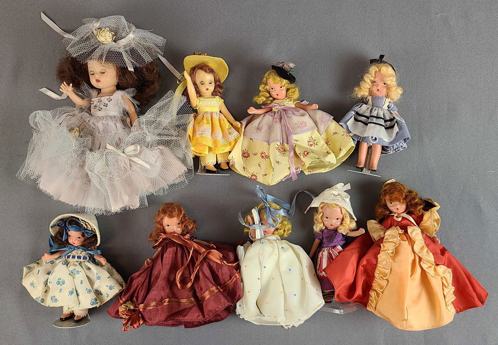 Group of 9 Storybook Dolls: 7 bisque.