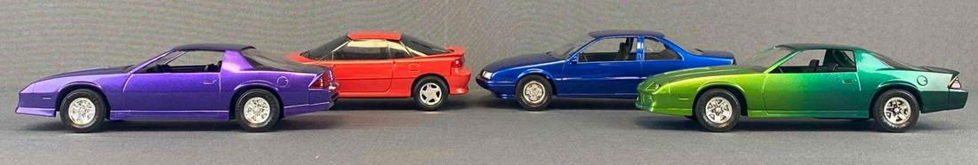 Group of 4 Dealership Promo Cars: Includes 1988 Chevrolet Beretta, 1991 GEO Storm GSI, 1987 228 Camaro, and more. Friction does not work on any.