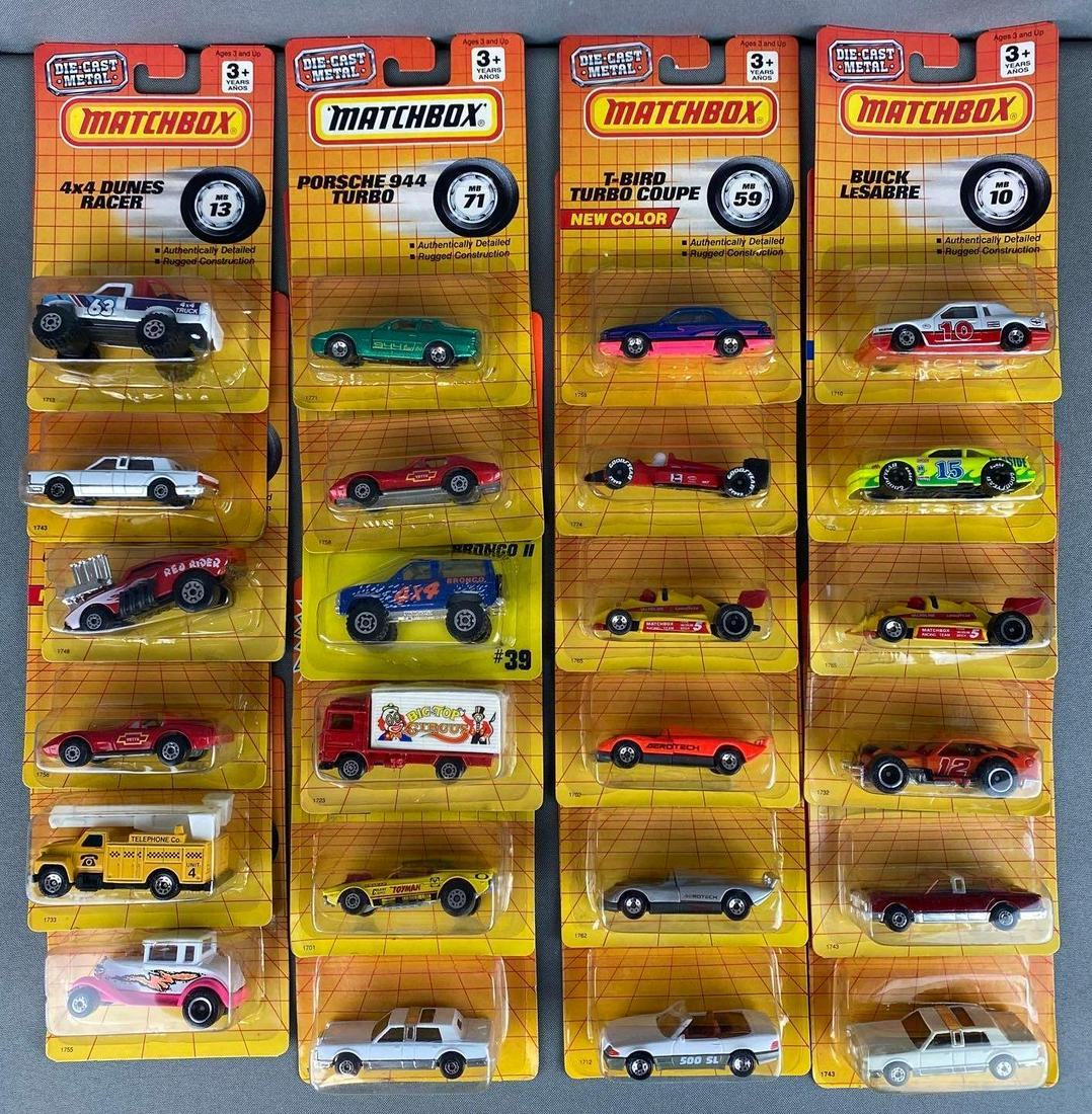 Group of 50+ Assorted Matchbox Die-Cast Vehicles: All in original packaging, includes Buick LeSabre, Porsche 944 Turbo, T-Bird Turbo Coupe, and more, includes duplicates, all measure 6 3/4 x 4 1/2 x 1 1/2in.