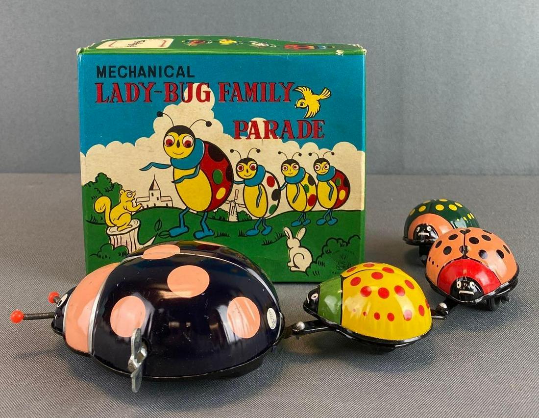 T. P. S. Lady Bug Family Parade Tin Wind Up Toy: in working condition, with original box, 13 X 3 3/4 X 1 3/4 inches