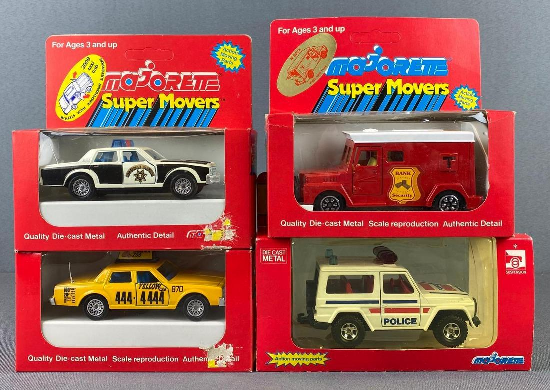 Group of 4 Majorette Die Cast Vehicles: in original boxes. 3017 Mercedes Police, 3024 bank security piggy bank, highway patrol and yellow cab