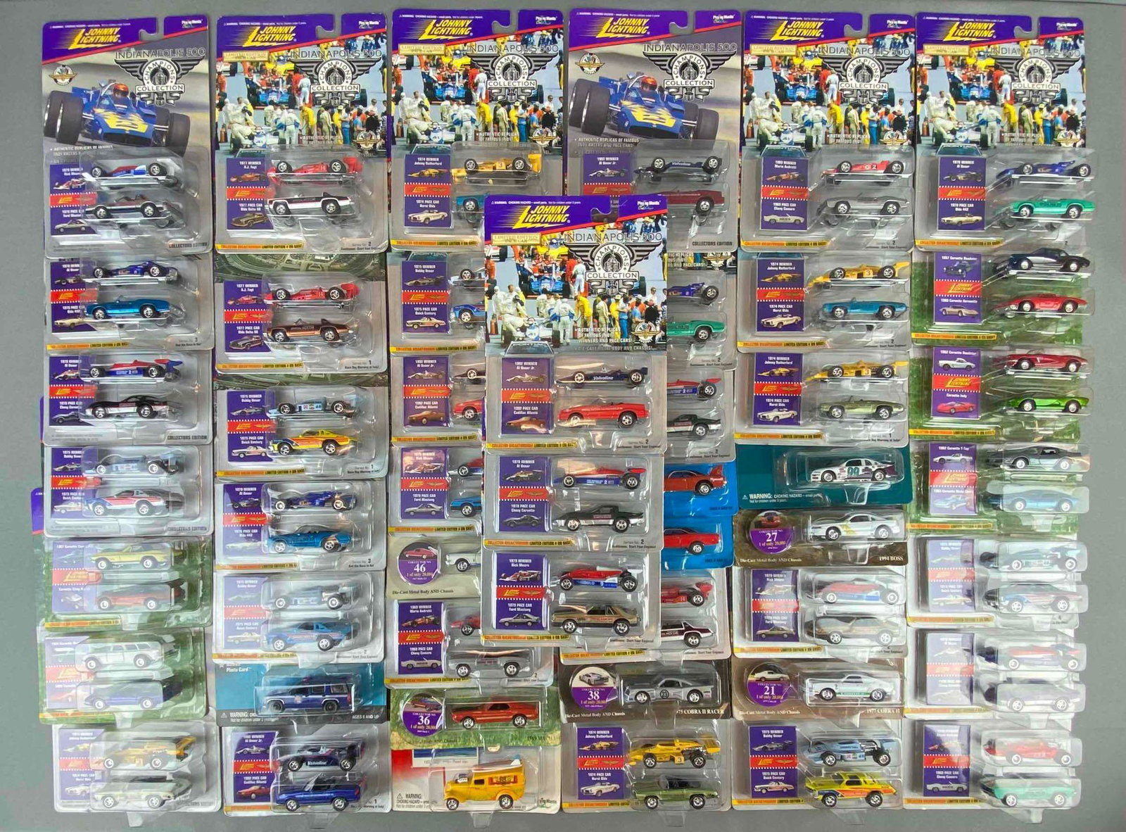 Group of Johnny Lightning Die Cast Vehicles: all in original packaging. includes 1994 boss, 1967 Shelby GT, 1969 Mach 1, 1977 Cobra 2, 1975 pace car buick century, 1965 corvette mako shark, and more