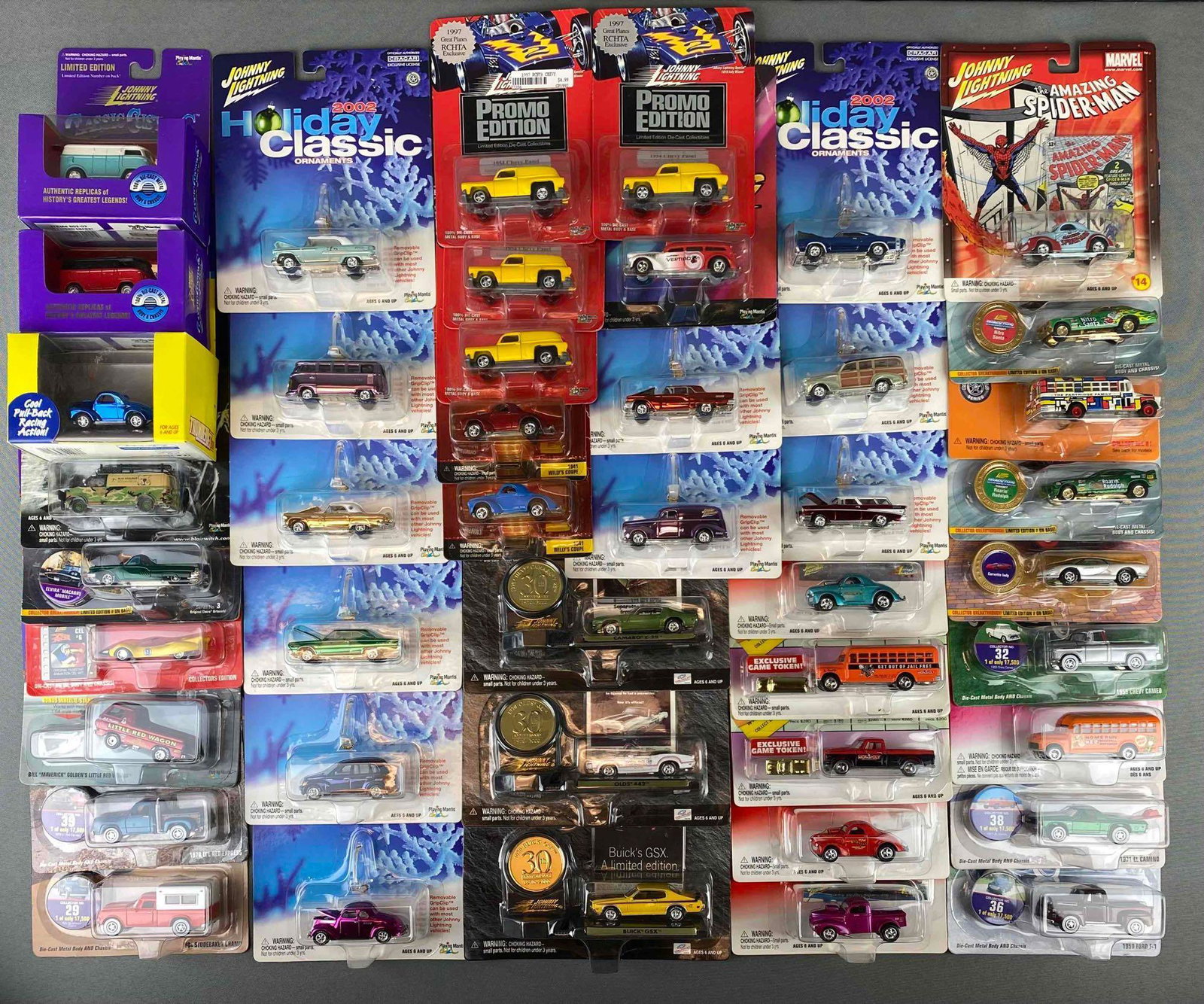 Group of Die Cast Vehicles and Ornaments: all in original packaging. includes Buick GSX, 1956 Chevy Bus, corvette Indy, Elvira macabre mobile, 1978 lil red express and more