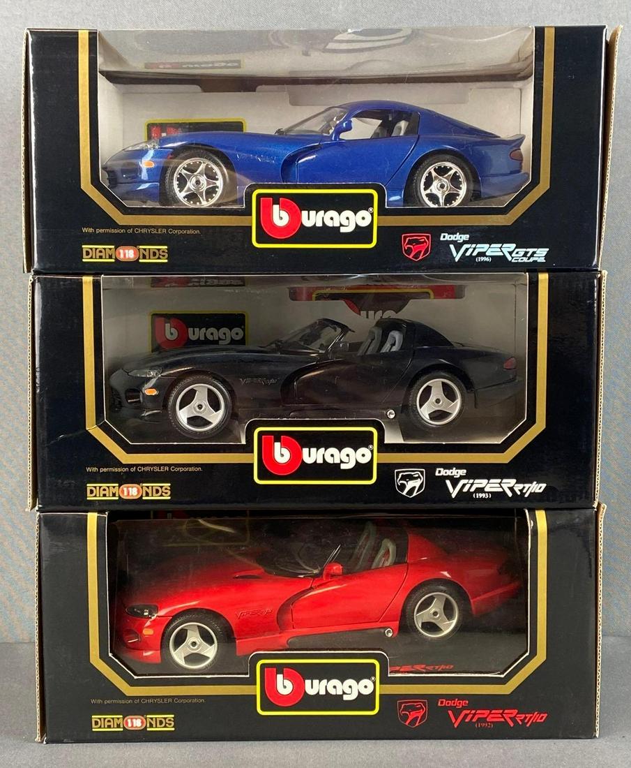 Group of 3 Bburago Dodge Viper Die-Cast Vehicles: 1/18th scale, includes 1996 Dodge Viper GTS Coupe, 1993 Dodge Viper RT/10, and 1992 Dodge Viper RT/10, boxes measures 5 x 12 x 7 1/4in.