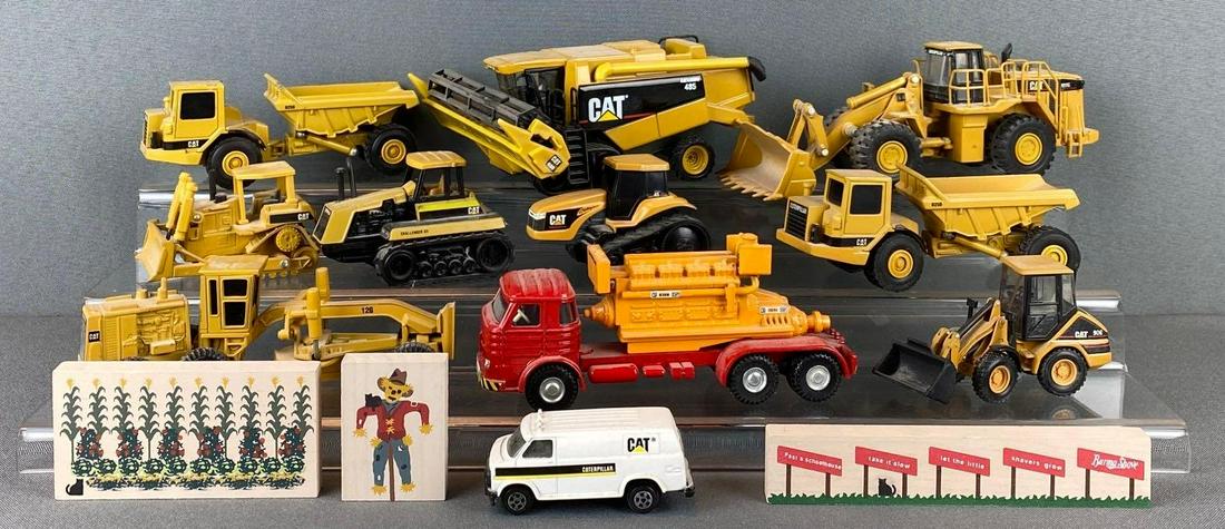 Group of Caterpillar Die Cast Vehicles: includes lexion 485, 988G, D25D, challenger 65, and more