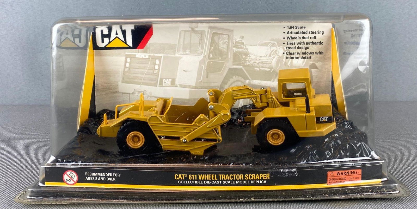 Norscot Die Cast Caterpillar 611 Wheel Tractor Scraper: 1:64 scale, in original box, box is 5 X 10 1/2 X 5 1/2 inches