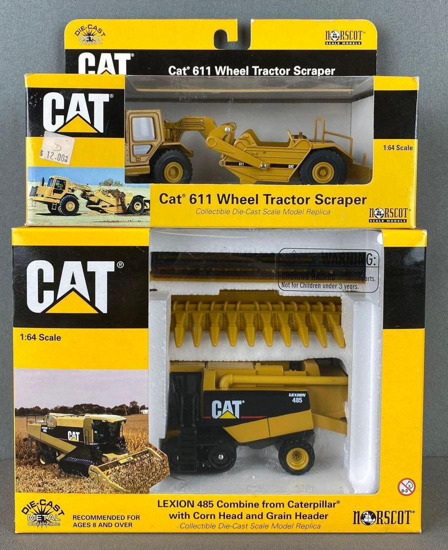 2 Norscot Die Cast Caterpillar Vehicles: includes 611 Wheel Tractor Scraper and Lexion 485 combine with corn head and grain header, with original boxes, largest box is 7 1/4 X 9 1/2 X 4 inches