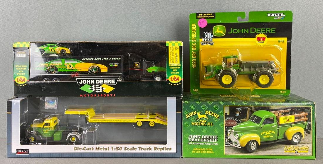 Group of 4 Die Cast John Deere Vehicles: all in original packaging. 4920 dry box spreader, 1947 studebaker pickup truck, transporter with stock car and international truck/trailer