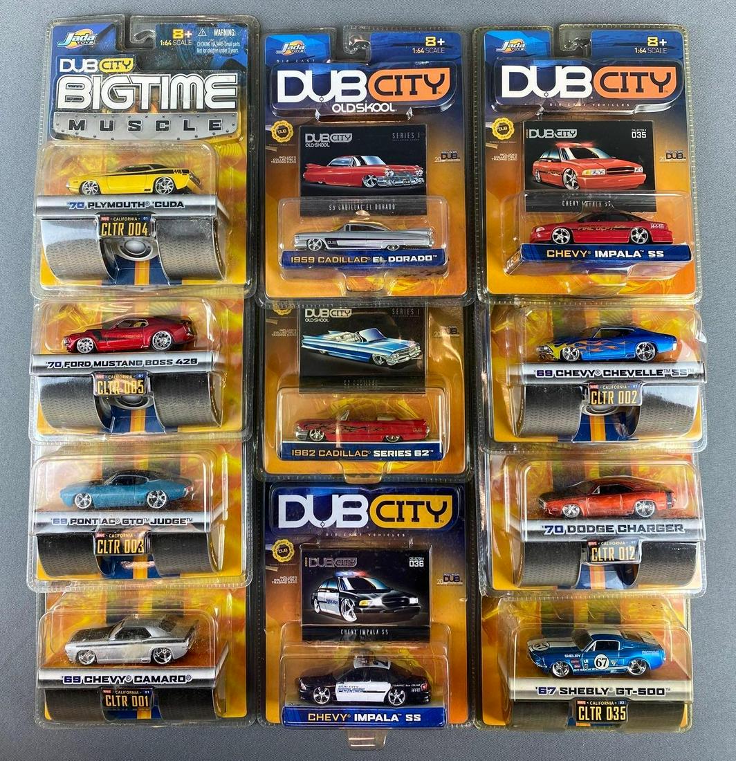Group of 11 Dub City Die Cast Vehicles: all in original packaging. includes 1970 Dodge Charger, 1970 Plymouth Cuda, 1969 Chevy Camaro, 1969 Chevy chevelle, and more