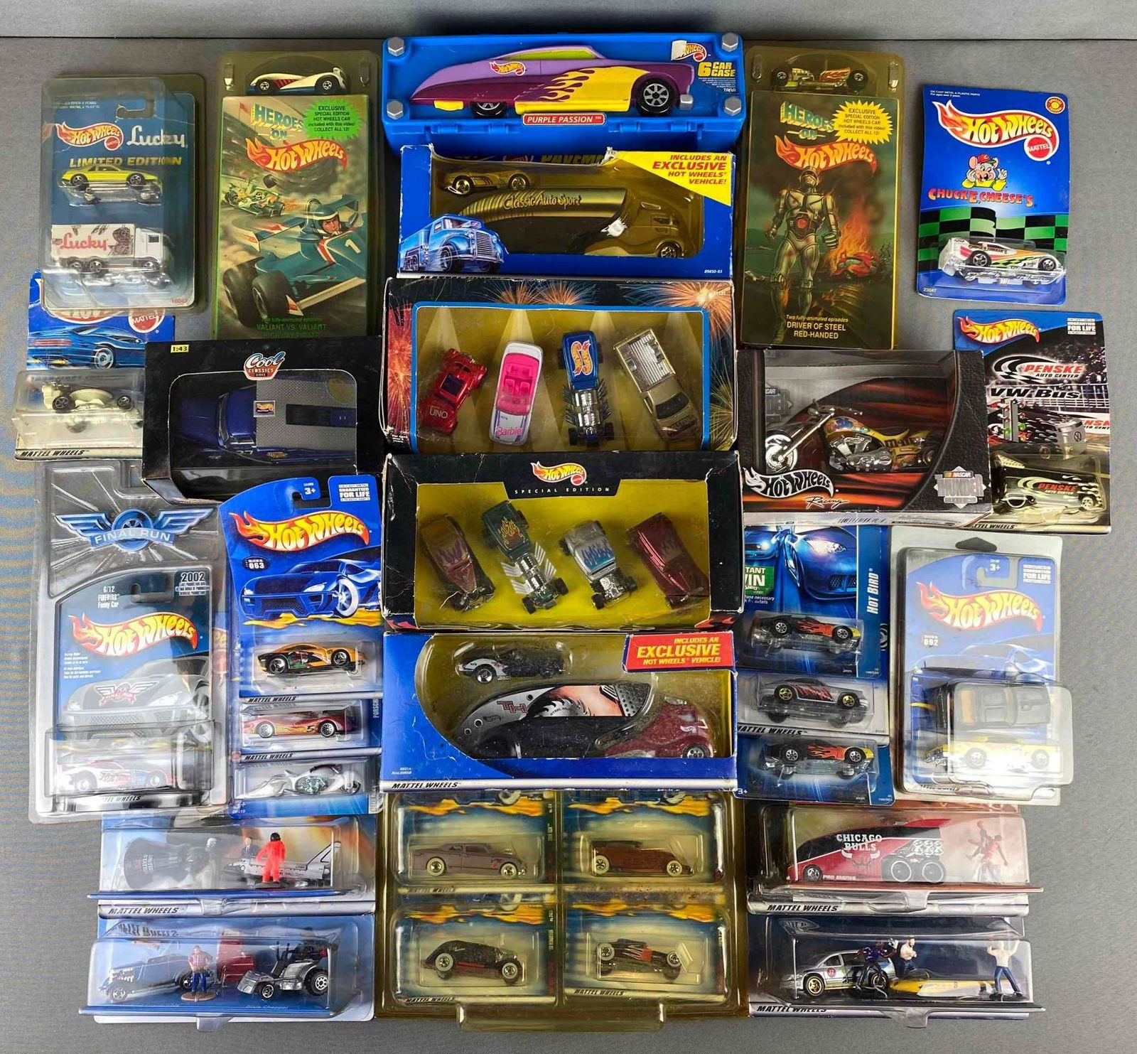 Group of Mattel Hot Wheels Die Cast Vehicles: all in original packaging. includes single cars, 4 car sets, vhs set, and more