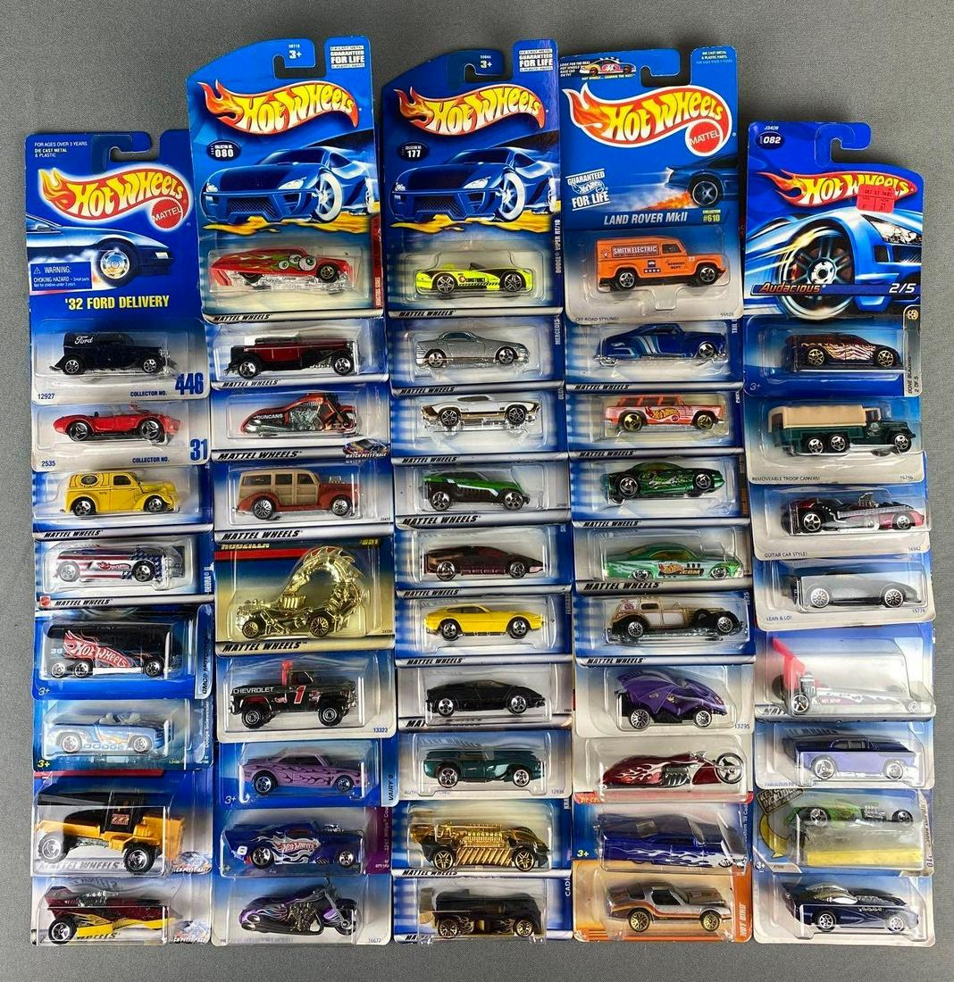 Group of Mattel Hot Wheels Die Cast Vehicles: in original packaging. includes dodge sidewinder, Cadillac LMP, Ferrari 365 GTB/4, GMC Motorhome, Chevy Nomad, and more