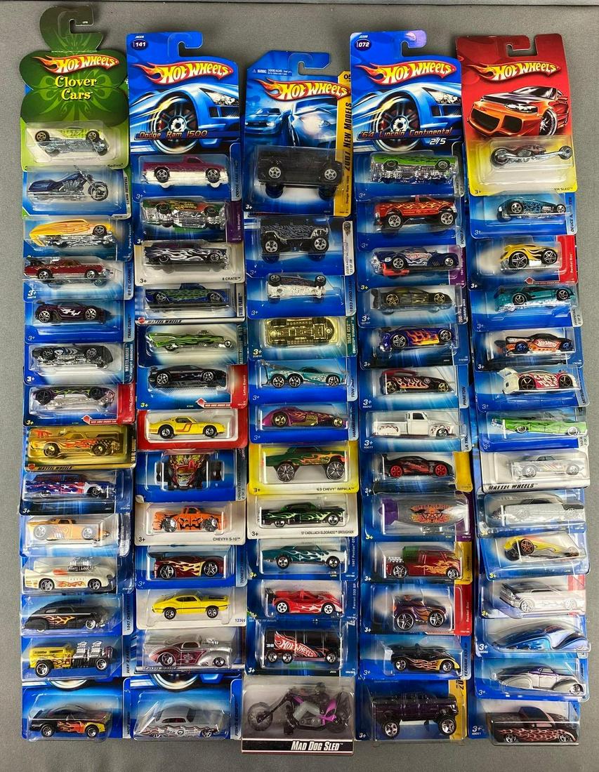 Group of Mattel Hot Wheels Die Cast Vehicles: in original packaging. includes lotus esprit, 1947 Chevy Fleetline, Ford F-150, deuce roadster, Dodge Ram 1500, and more