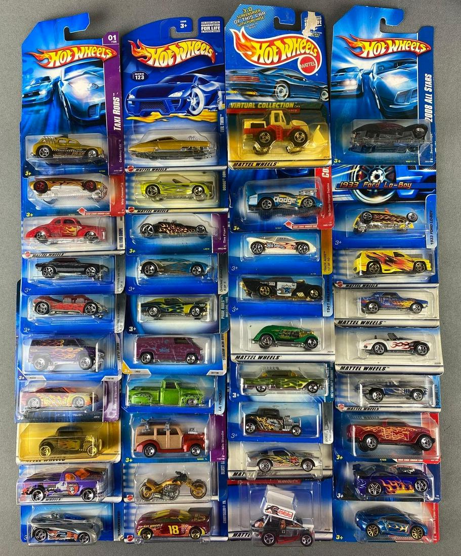 Group of Mattel Hot Wheels Die Cast Vehicles and Backpack: in original packaging. includes Mitsubishi Eclipse concept car, 1940s woodie, Chrysler Thunderbolt, Ford F-150, 1965 corvette, and more