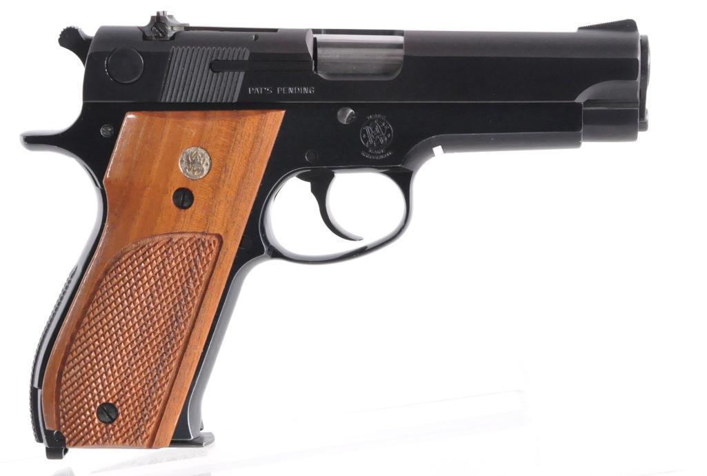Smith and Wesson Model 39-2 9mm Semi Auto Pistol with Original Box: Serial Number A537214, 4 inch Barrel, S&W 39-2 Semi Auto Handgun bl w/checkered wood grips, 2 magazines marked S&W, 9mm cal., Manufactured from 1970 to 1982, very little wear, 99% condition