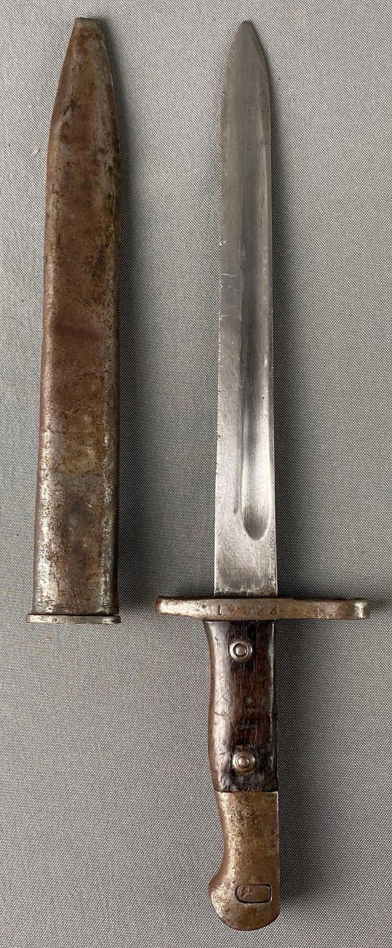 WWI Turkish German Mauser Bayonet and Sheath: #12023 engraved on handle, wood handle, measures 14 3/4in long.