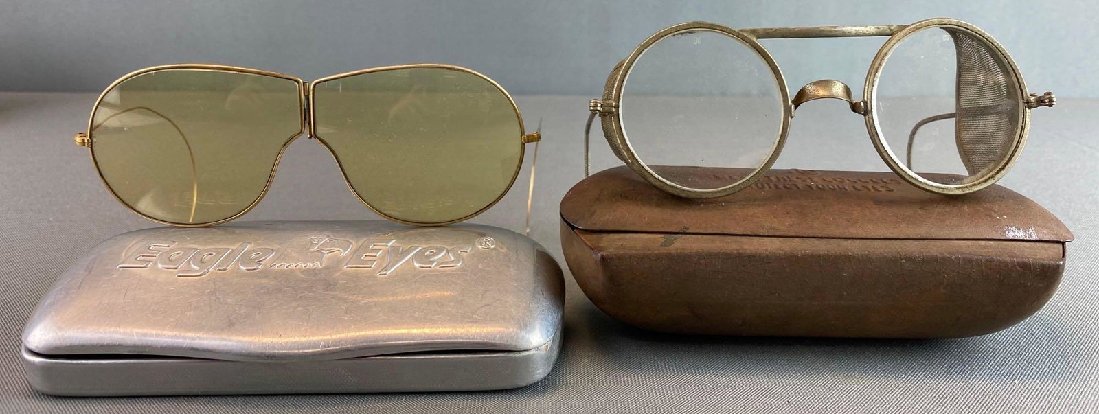 2 Pairs of Military Glasses: with cases, foldable, largest is 5 1/2 X 2 inches