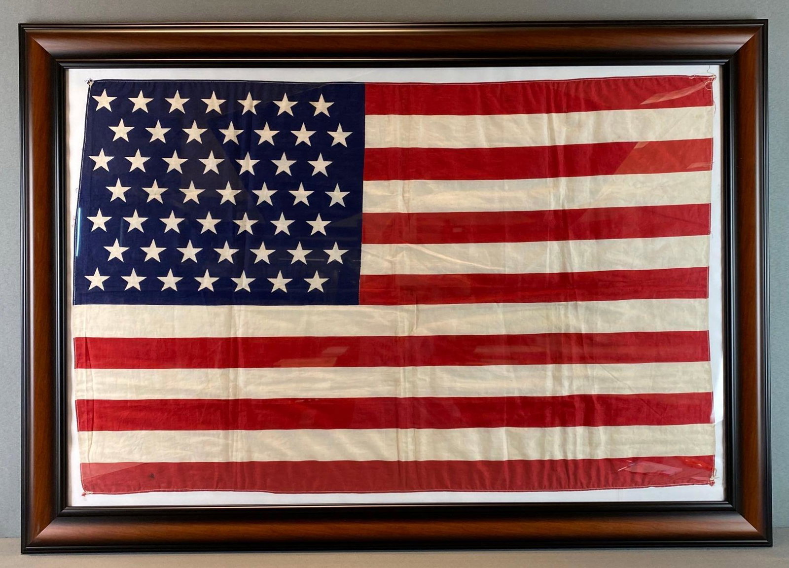Framed 49 Star US Flag: flag is 22 1/4 X 34 1/4 inches, frame is 28 1/2 X 40 1/2 inches